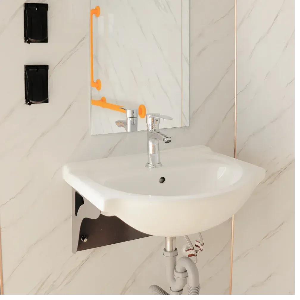 Fold-down shower seat detail