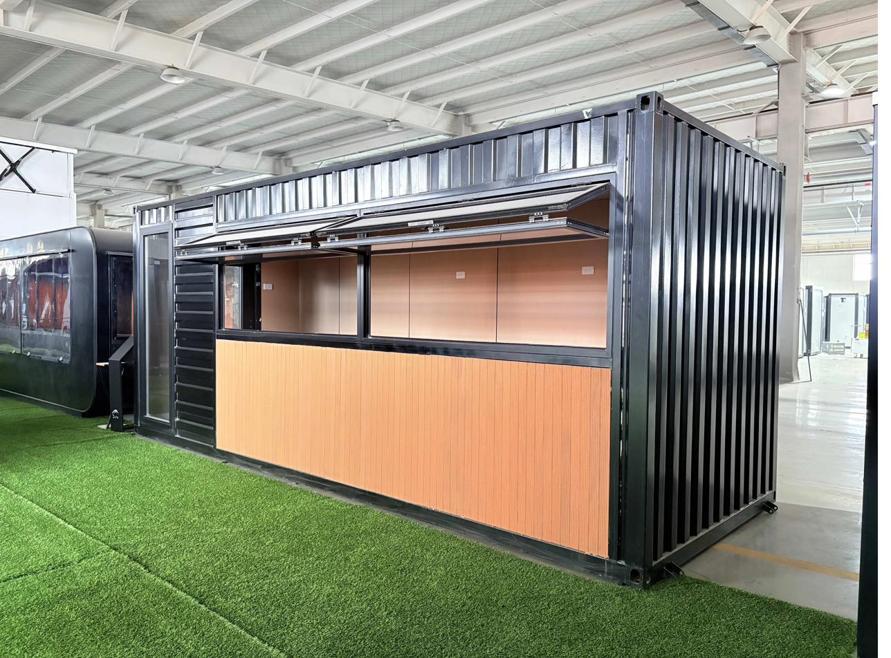 20 foot container kiosk with hydraulic shutters open for service